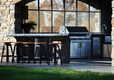 A relaxing covered patio to entertain your guests including a bar.