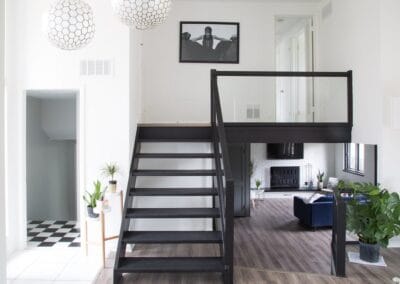 A custom built home with cool wood flooring, and white walls for a contrast.