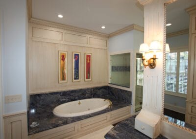 A custom built bathroom featuring cool-toned granite.