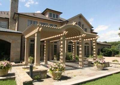 A custom built patio pergola featuring tan columns