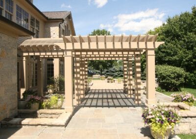 A custom built patio pergola featuring tan columns