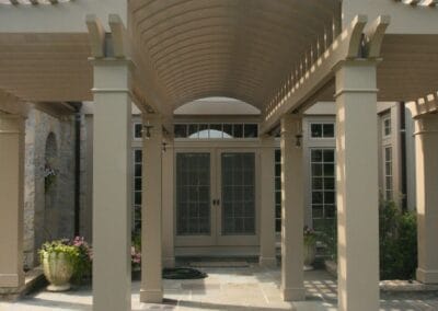 A custom built patio pergola featuring tan columns