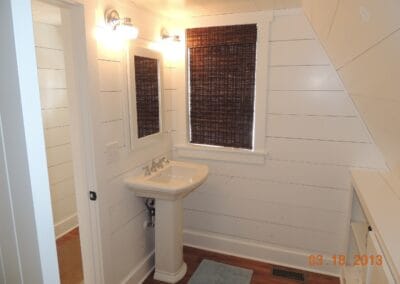 A white custom ski cabin featuring a white bathroom.