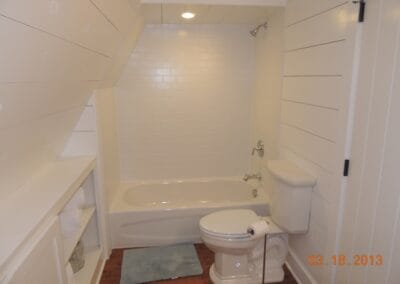 A white custom ski cabin featuring a white bathroom.