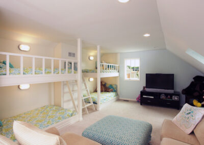 A spacious kid's room with two built in full bunk beds.