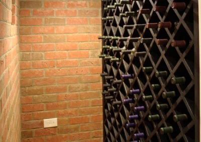 A wine cellar with a full wall wine rack