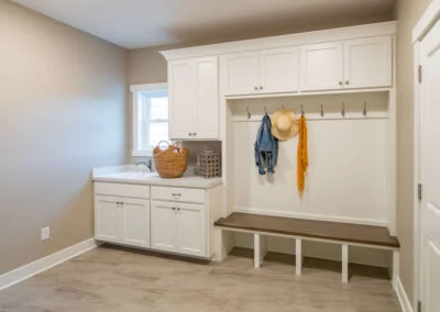 Custom-built white & brown bench and coat hanger.