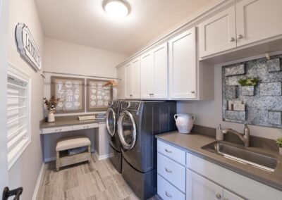 A custom grey & neutral brown colored laundry room.