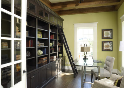 Custom-built cabinetry & book shelf with a ladder.