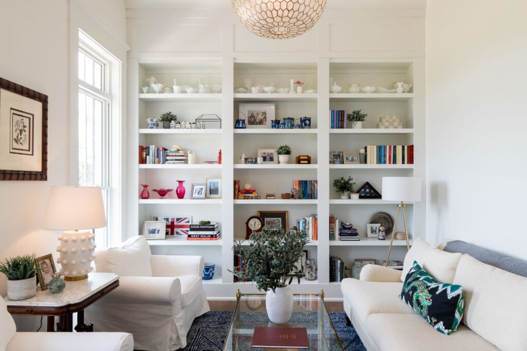 A custom built book shelf from floor to ceiling to spotlight your favorite books, and decorations