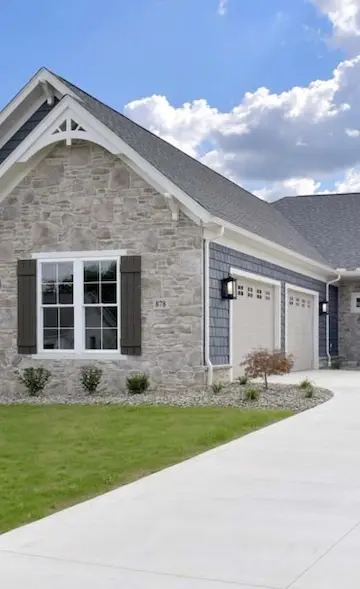 side of house showing off beautiful stonework<br />